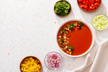Spanish tomato gazpacho cold soup styled and decorated in white plate