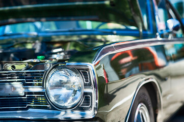 Vintage car on display at automotive show. 
