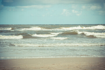 View on beach and sea waves. Stormy and windy day at sea. Travel