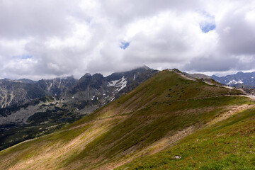 
Natural daytime view of the Polish Tatra Mountains with hiking trails popular with tourists
