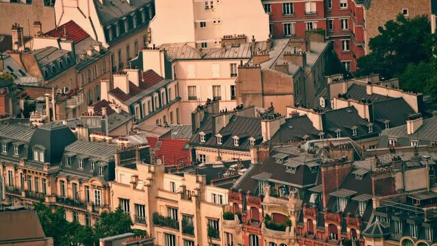 View from above of residential buildings and classic roofs in Paris, France