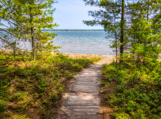 Fototapeta na wymiar Boardwalk to the beach in Big Bay State Park on Lake Superior on Madeline Island in the Apostle Islands National Lakeshore in Wisconsin USA