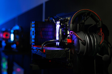 A top-end system unit for a gaming computer in close-up with neon illumination.