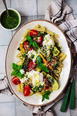 Pasta with grilled zuccini, buratta and pesto and Basil  .top veiw.selective focus