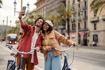 Tourist taking selfie on the city street.