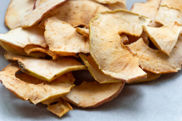 Dried white apple slices on the table