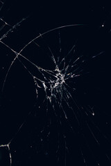 Cracked glass on a black background closeup