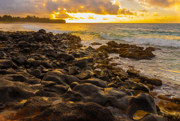 Sunrise on The Volcanic Shoreline of Shipwreck Beach, Poipu, Kauai, Hawaii, USA