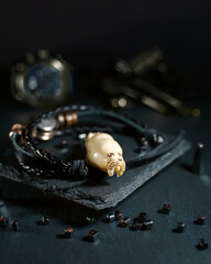 An amulet in the shape of a walrus head made of walrus tusk bone