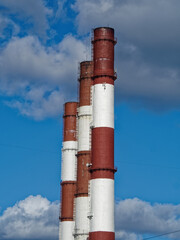 An element of industry against a blue sky.