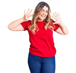 Young caucasian woman wearing casual clothes showing and pointing up with fingers number nine while...
