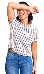 Obraz premium Young woman wearing casual clothes covering eyes with arm smiling cheerful and funny. blind concept.