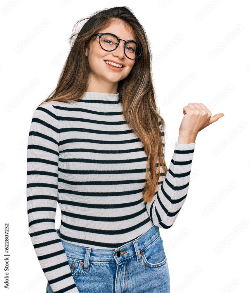 Sticker young beautiful teen girl wearing casual clothes and glasses smiling with happy face looking and poi