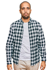 Hispanic adult man wearing casual clothes depressed and worry for distress, crying angry and afraid. sad expression.