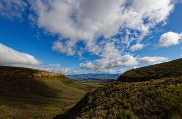 A panoramic view over a winter landscape with blue skies near Ceres, Western Cape, South Africa.