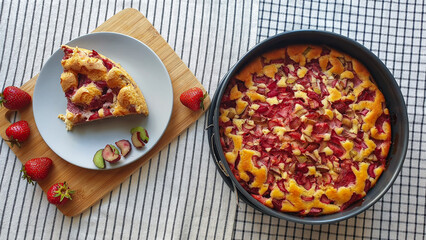 Strawberry and rhubarb sponge cake on a plate and in baking mold