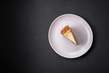 Delicious sweet cheesecake cake on textured concrete background