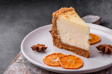 Delicious sweet cheesecake cake on textured concrete background