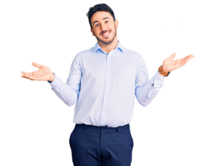 Young hispanic man wearing business clothes clueless and confused expression with arms and hands raised. doubt concept.