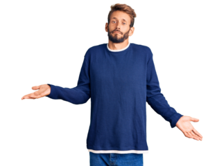 Handsome blond man with beard wearing casual sweater clueless and confused expression with arms and hands raised. doubt concept.