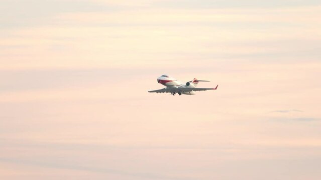 Generic Private VIP Executive Business Jet Taking Off into a Vibrant Orange Morning Sky Shortly After Take-off