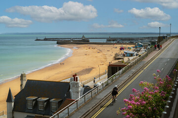 Ramsgate beach main sands in Kent UK with the Royal harbour in the background on a summer day.