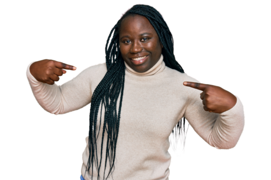 Young black woman with braids wearing casual winter sweater looking confident with smile on face, pointing oneself with fingers proud and happy.