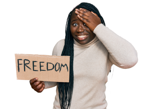 Young black woman with braids holding freedom banner stressed and frustrated with hand on head, surprised and angry face
