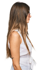Obraz premium Young hispanic woman wearing casual clothes looking to side, relax profile pose with natural face with confident smile.