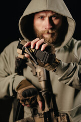 Portrait of Ukrainain defender holding a medical tourniquet