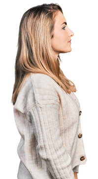 Young blonde woman wearing casual clothes looking to side, relax profile pose with natural face and confident smile.