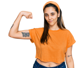 Young hispanic woman wearing casual clothes strong person showing arm muscle, confident and proud of power