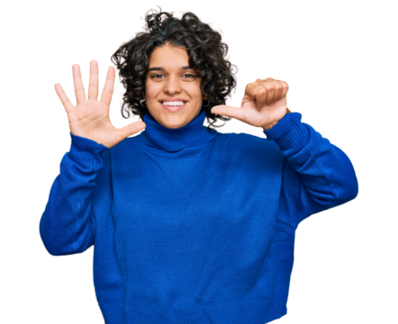 Young hispanic woman with curly hair wearing turtleneck sweater showing and pointing up with fingers number six while smiling confident and happy.