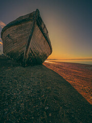 Wooden boat stranded on the beach