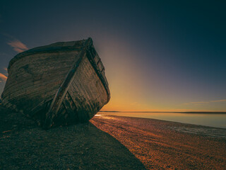 Wooden boat stranded on the beach