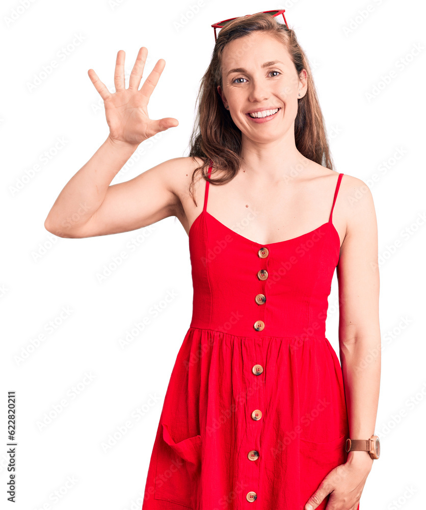 Sticker young beautiful blonde woman wearing casual dress showing and pointing up with fingers number five w