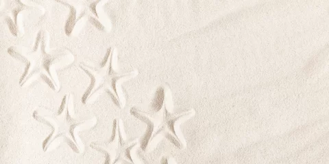 Fotobehang Texture of beach sand with seashells imprint. Starfish imprint on sand. Seashells on sand beach © prime1001