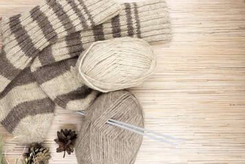 Cozy knitted socks and skeins.