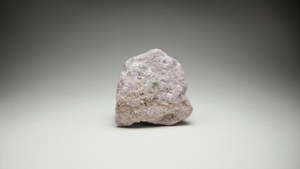 A rock with a hint of pink color called Lepidolite