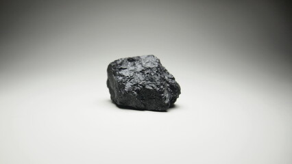 Shiny obsidian ozocerite gemstone rock