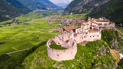 Poster Castel Beseno aerial drone panoramic view - Most famous and impressive historical medieval castles of Italy in Trento province, Trentino region © Freesurf