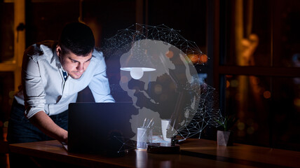 Young man entrepreneur working on laptop, using chatbot