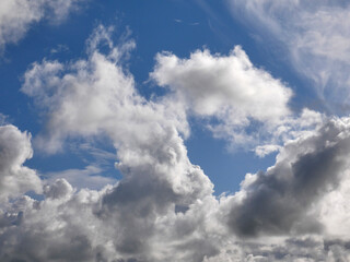 Naklejka na ściany i meble White fluffy clouds over blue sky background, beautiful heaven photo