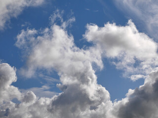 Fototapeta na wymiar White fluffy clouds over blue sky background, beautiful heaven photo