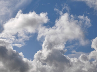 White fluffy clouds over blue sky background, beautiful heaven photo