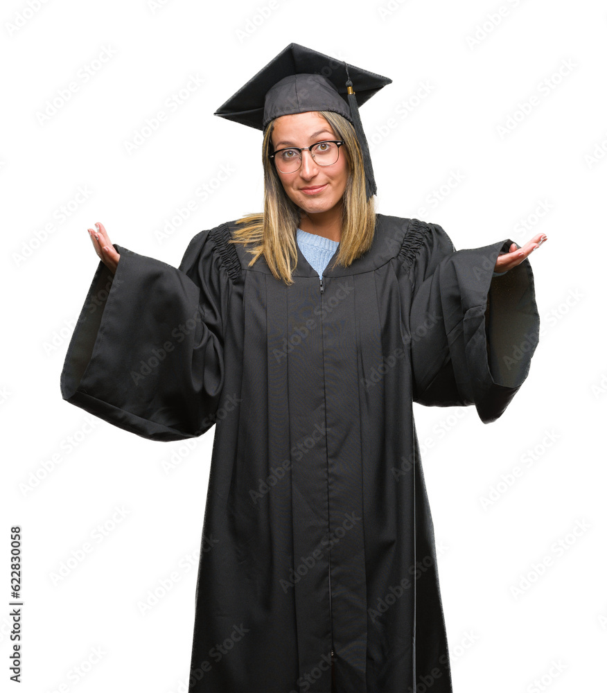 Poster Young beautiful woman wearing graduated uniform over isolated background clueless and confused expression with arms and hands raised. Doubt concept.