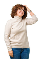 Beautiful middle ager senior woman wearing turtleneck sweater and glasses over isolated background Smiling confident touching hair with hand up gesture, posing attractive