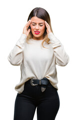 Young beautiful woman casual white sweater over isolated background with hand on head for pain in head because stress. Suffering migraine.