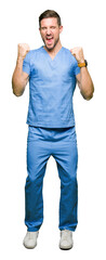 Handsome doctor man wearing medical uniform over isolated background very happy and excited doing...