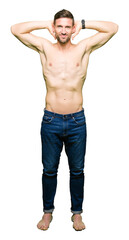 Fototapeta premium Handsome shirtless man showing nude chest Relaxing and stretching with arms and hands behind head and neck, smiling happy